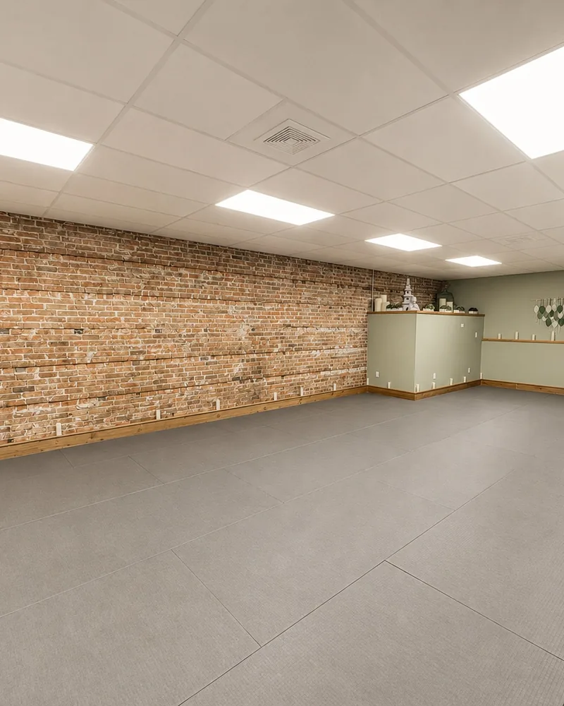 The practice room’s brick wall and sage-green trim